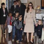 Accompanied by their children, US movie stars Brad Pitt and Angellina Jolie appear before photographers upon their arrival at Haneda Airport in Tokyo on November 8, 2011. Brad Pitt is here for the Japan premiere of his last film 'Moneyball'. A...