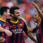 Barcelona's Argentinian forward Lionel Messi (L) celebrates with his teammates after scoring during the Spanish league football match UD Almeria vs FC Barcelona at the Juegos Mediterraneos stadium in Almeria on September 28, 2013. AFP PHOTO/ J...