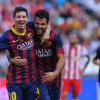 Barcelona's Argentinian forward Lionel Messi (L) celebrates with midfielder Cesc Fabregas after scoring during the Spanish league football match UD Almeria vs FC Barcelona at the Juegos Mediterraneos stadium in Almeria on September 28, 2013. A...