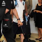 Barcelona's Lionel Messi from Argentina, center, walks to a waiting vehicle upon his arrival at La Aurora airport in Guatemala City, early Wednesday, June 12, 2013. A tax fraud lawsuit has been filed by a Spanish state prosecutor of Catalonia ag...