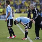 Argentina's coach Alejandro Sabella, right, pats Argentina's Lionel Messi on the back during a 2014 World Cup qualifying soccer match with Ecuador in Quito, Ecuador, Tuesday, June 11, 2013. (AP Photo/Dolores Ochoa).