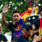 BARCELONA, SPAIN - MAY 13: Lionel Messi of FC Barcelona celebrates with team-mates on an open top bus during their victory parade after winning the Spanish Liga title on May 13, 2013 in Barcelona, Spain. (Photo by David Ramos/Getty Images)