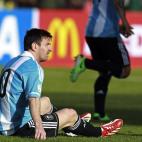 Argentina's Lionel Messi sits on the pitch during a World Cup 2014 qualifying soccer match against Bolivia in La Paz, Bolivia, Tuesday, March 26, 2013. (AP Photo/Juan Karita)