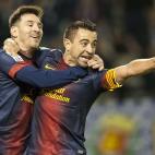 VALLADOLID, SPAIN - DECEMBER 22: Xavi Hernandez of FC Barcelona celebrates with his teammate Lionel Messi after scoring against Real Valladolid during the La Liga game between Real Valladolid and FC Barcelona at Jose Zorrilla on December 22, 20...