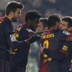 Barcelona's Lionel Messi, right, celebrates with teammates Daniel Alves, second right, Alexandre Song, second left, and Gerard Pique, left, after scoring against Cordoba during the 1st leg of a last-16 Copa del Rey soccer match at Arcangel stadi...