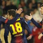 Barcelona's Lionel Messi from Argentina, right, celebrates with teammate Alexis Sanchez, left, after scoring against Betis during their La Liga soccer match at the Benito Villamarin stadium, in Seville, Spain on Sunday, Dec. 9, 2012. (AP Photo/A...