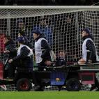 Barcelona's Argentinian forward Lionel Messi leaves the pitch on a stretcher after being injured during the UEFA Champions League football match FC Barcelona vs SL Benfica at the Camp Nou stadium in Barcelona on December 5, 2012. AFP PHOTO / J...