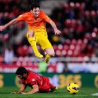 MALLORCA, SPAIN - NOVEMBER 11: Lionel Messi of FC Barcelona duels for the ball with Bigas of RCD Mallorca during the La Liga match between RCD Mallorca and FC Barcelona at Iberostar Stadium on November 11, 2012 in Mallorca, Spain. (Photo by Da...