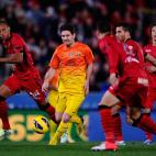 MALLORCA, SPAIN - NOVEMBER 11: Lionel Messi of FC Barcelona (2ndL) duels for the ball with RCD Mallorca players during the La Liga match between RCD Mallorca and FC Barcelona at Iberostar Stadium on November 11, 2012 in Mallorca, Spain. (Photo...