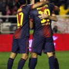 FC Barcelona's Lionel Messi from Argentina, centre, celebrates his goal with team mates during a Spanish La Liga soccer match against Rayo Vallecano at the Teresa Rivero stadium in Madrid, Spain, Saturday, Oct. 27, 2012. (AP Photo/Andres Kudacki)