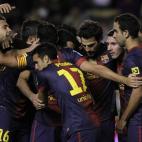 FC Barcelona's Lionel Messi from Argentina, second left, celebrates his goal with team mates during a Spanish La Liga soccer match against Rayo Vallecano at the Teresa Rivero stadium in Madrid, Spain, Saturday, Oct. 27, 2012. (AP Photo/Andres Ku...