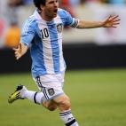 Argentinian soccer player Lionel Messi celebrates after scoring his third goal during a friendly match against Brazil at the MetLife Stadium in East Rutherford, New Jersey, on June 9, 2012. Argentina won 4-3. AFP PHOTO/Mehdi Taamallah ...