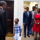 Sept. 4, 2015 "Four-year-old Malik Hall greets the President, almost in disbelief, before a departure photo with Malik's uncle Maurice Owens, center, and his family." (Official White House Photo by Pete Souza)