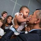 President Barack Obama holds a baby during a U.S. Embassy meet and greet in Kingston, Jamaica, April 8, 2015. (Official White House Photo by Pete Souza)