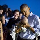 President Barack Obama holds a baby during the Congressional Picnic on the South Lawn of the White House, Sept. 17, 2014. (Official White House Photo by Pete Souza)