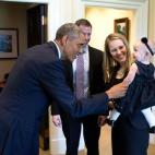 President Barack Obama greets departing staff member Lindsay Hayes and family in the Outer Oval Office, Sept. 26, 2014. (Official White House Photo by Pete Souza)