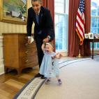 April 4, 2014 "Despite the haphazard framing, I love the expressions on the President and one-year-old Lincoln Rose Smith as she learns to walk in the Oval Office. This moment happened when former Deputy Press Secretary Jamie Smith and her fami...
