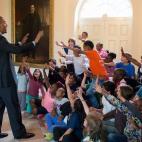 President Barack Obama greets children participating in the White House Healthy Kids & Safe Sports Concussion Summit, in the East Garden Room of the White House, May 29, 2014. The President met with the group indoors when their South Lawn event ...