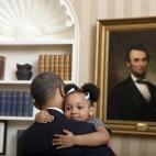 Feb. 1, 2012 "Lawrence Jackson captured this cute photograph of the President holding Arianna Holmes, 3, before taking a departure photo with members of her family in the Oval Office." (Official White House Photo by Lawrence Jackson)