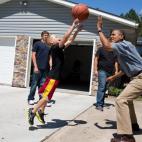 President Barack Obama plays basketball during a visit to the McIntosh family farm in Missouri Valley, Iowa, Aug. 13, 2012. The President toured a cornfield on the family farm to view the effect the drought is having on crops. (Official White Ho...