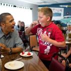 President Barack Obama shares his strawberry pie with a boy during a lunch stop at Kozy Corners restaurant in Oak Harbor, Ohio, July 5, 2012. (Official White House Photo by Pete Souza)