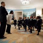 President Barack Obama and Massachusetts Gov. Deval Patrick listen as students from Orchard Gardens K-8 School in Roxbury, Mass., perform Dr. Marin Luther King Jr.'s "I Have a Dream" speech in the Diplomatic Reception Room of the White House, Fe...