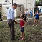 President Barack Obama greets a girl while touring a neighborhood affected by Hurricane Irene in Wayne, N.J., Sept. 4, 2011. (Official White House Photo by Pete Souza)