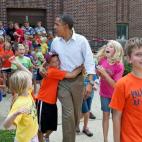 President Barack Obama greets children from the Valleyland Kids summer program outside a school in Chatfield, Minn., during a three-day bus tour in the Midwest, Aug. 15, 2011. (Official White House Photo by Pete Souza)
