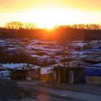 CALAIS, FRANCE - FEBRUARY 29: The sun rises over the 'jungle' migrant camp on February 29, 2016 in Calais, France The French authorities have begun dismantling part of the migrant encampment in the northern French town of Calais and relocating ...
