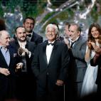 FILE - In this Feb. 24, 2017 file photo, French actor Jean-Paul Belmondo, center, is congratulated by actors on stage during the ceremony of the 42nd Cesar Film Awards, at the Salle Pleyel, in Paris. French New Wave actor Jean-Paul Belmondo has ...