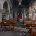 Una iglesia de Mosul parcialmente destruida por el Estado Islámico. Mosul, controlada por los yihadistas desde 2014, es la segunda ciudad más importante del país y en torno a un millón y medio de personas vive en ella. Los expertos han augur...