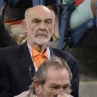Actor Sean Connery watches Russian tennis player Mikhail Youzhny playing a point against Serbia's Novak Djokovic during their 2013 US Open men's singles match at the USTA Billie Jean King National Tennis Center in New York on September 5, 2013. ...