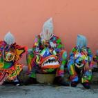 Miembros de los Diablos Danzantes de Naiguata forman parte de una celebración católica del Corpus Christi en La Guaira, Venezuela.