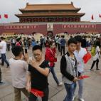En China lo de manifestarse por los derechos de los trabajadores no se estila... Pero los trabajadores aprovechan la jornada festiva para hacer turismo.