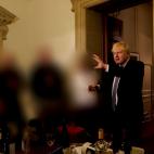 British Prime Minister Boris Johnson gestures in 10 Downing Street during gathering on the departure of a special adviser, in London, Britain November 13, 2020 in this picture obtained from civil servant Sue Gray's report published on May 25, 20...