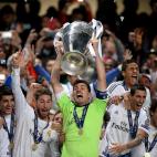 Real Madrid goalkeeper and captain Iker Casillas lifts the UEFA Champions League trophy