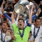 Real Madrid goalkeeper and captain Iker Casillas lifts the UEFA Champions League trophy