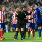 Atletico Madrid manager Diego Simeone speaks with match referee Bjorn Kuipers