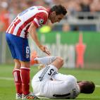 Atletico Madrid's Koke (left) checks on the condition of Real Madrid's Daniel Carvajal