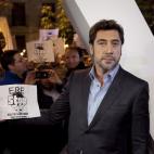 Spanish actor Javier Bardem shows his support for Spanish theatre workers as he holds a banner aimed against austerity measures in public theaters of Madrid, after a photo call for the new James Bond film "Skyfall" was disrupted at the Teatro Es...