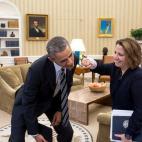 Lisa Monaco, assistant to the president for homeland security and counterterrorism, pretends to punch the president with her cast in the Oval Office on March 5, 2015.