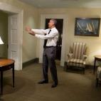 Obama gestures to a departing guest in a hallway of the West Wing of the White House on April 29, 2015.