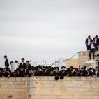 Ultra-Orthodox Jews participate in the funeral for prominent rabbi Meshulam Soloveitchik, in Jerusalem, Sunday, Jan. 31, 2021. The mass ceremony took place despite the country's health regulations banning large public gatherings, during a nation...