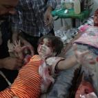 Medics Assist a Wounded Girl. Abd Doumany, Syria, Agence France-Presse. 
