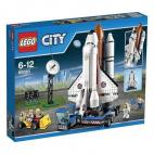 Puerto Espacial de Lego Lanzadera y plataforma de lanzamiento móvil que recrea un puerto espacial, con minifiguras de una científica, dos técnicos y dos astronautas.