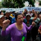 Demonstrators demand humanitarian aid during a protest against the government of President Nicolas Maduro, called by opposition leader and self-proclaimed 'acting president' Juan Guaido, outside the 'Dr. JM de los Rios' Children's Hospital in Ca...