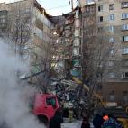 MAGNITOGORSK, RUSSIA - DECEMBER 31, 2018: Clearing the debris at the site of an apartment building collapse. A suspected domestic gas blast caused a partial collapse of a residential building at 164 Karla Marksa Prospekt Street killing three peo...