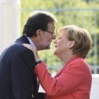 Merkel dando la bienvenida a Rajoy.