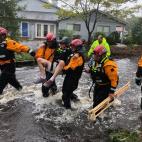 Search and Rescue workers from New York rescue a man from flooding caused by Hurricane Florence in River Bend, North Carolina, U.S. in this September 14, 2018 handout photo. NYC Emergency Management/Handout via REUTERS ATTENTION EDITORS - THI...