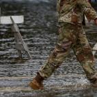A member of the U.S. Army walks through floodwaters near the Union Point Park Complex as Hurricane Florence comes ashore in New Bern, North Carolina, U.S., September 13, 2018. REUTERS/Eduardo Munoz